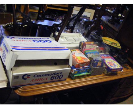 A Commodore Amiga 600 Games Console, together with games, joysticks and other accessories  
