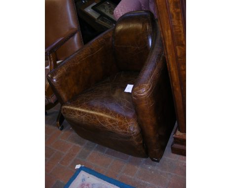 An Art Deco style brown leather easy chair CONDITION REPORT Height 74cmWidth 78cmDepth 80cm