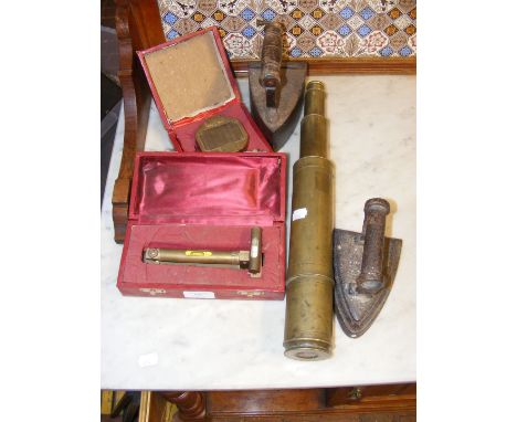 A brass telescope, together with Victorian irons, Brunton compass and a level 