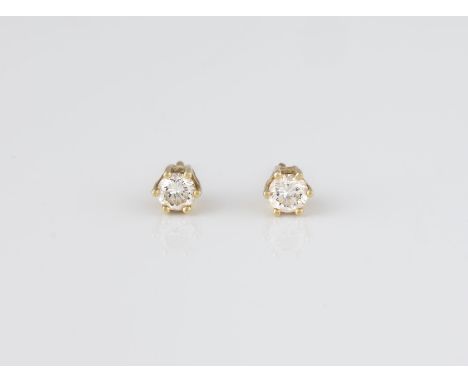PAAR BRILLANT-OHRSTECKER Gelbgold. D. ca. 0,5 cm, Ges.-Gew. ca. 1,4 g. Geprüft 14 K. Jeweils ein Brillant, zusammen ca. 0,4 c