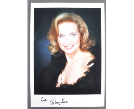 From the collection of Valerie Leon - a large and impressive 16x12" (approx) colour matte image of Ms Leon, wearing a feather