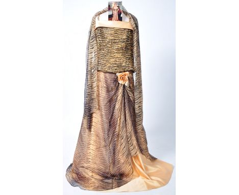 From the collection of Valerie Leon - a personally owned and worn evening gown. By Lore, the ensemble comprising of a sequin 