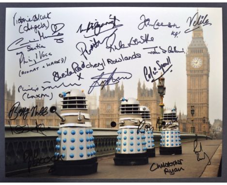 Doctor Who - an incredible impressive multi-signed autographed 11x14" colour photograph from the series, signed by x20 stars 