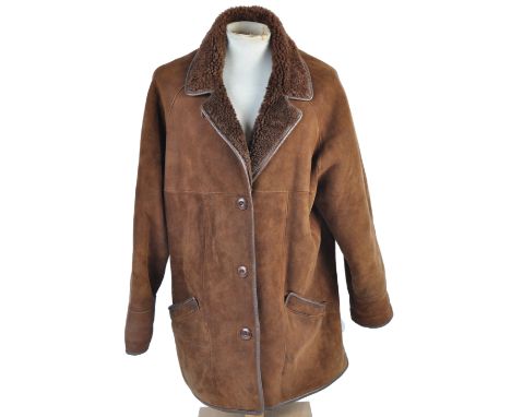From the Estate of Peter Wyngarde - an original vintage Woolea made ' Genuine Lambskin ' brown jacket, with a woollen lining.