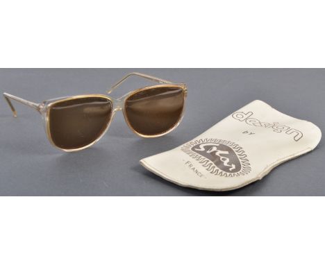 From the Estate of Peter Wyngarde - A pair of vintage Schillaci made ' Instyle '&nbsp; sunglasses. Clear plastic frames, with