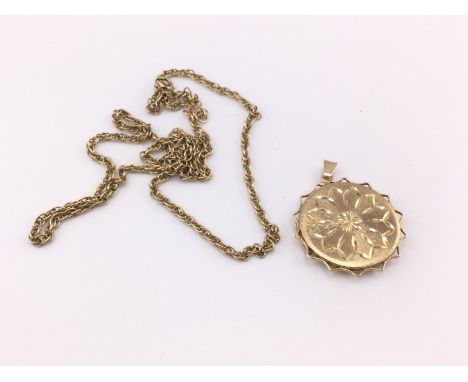 A 9ct gold pendant 7.49g and 9ct chain 10g