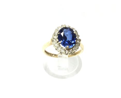 A 9ct gold diamond and sapphire cluster ring. 2.76g and size K 1/2