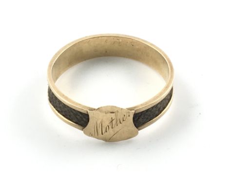 A 15ct gold Victorian memorial ring with plated hair. Size S and 2.21g.