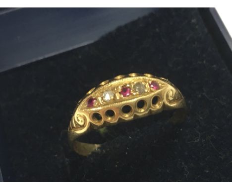 An 18ct gold diamond /ruby set ring. Size Q. Total weight 2.5g Postage category A