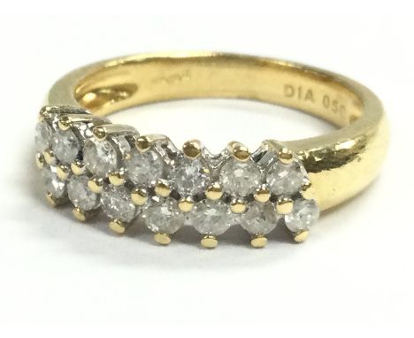 An 18 carat gold double row diamond ring , size k . 4.6g Postage cat A