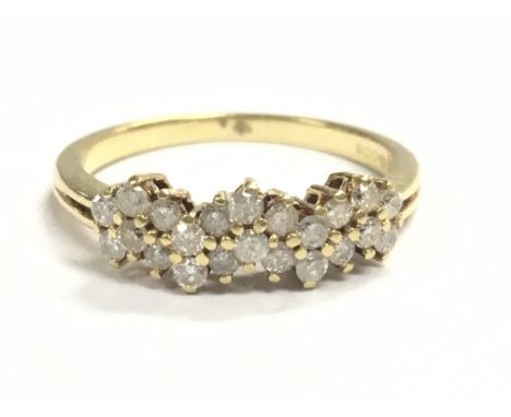 An 18ct gold diamond cluster band ring, 2.58g total weight. Size L. Postage category A