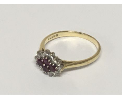 An 18carat gold ring set with a pattern of four ruby flanked by brilliant cut diamonds. Weight 3g ring size R.
