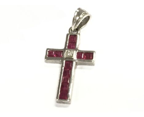 An 18ct white gold ruby and diamond cross pendant , 2g total weight. Postage category A