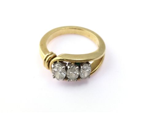 An 18ct gold three diamond set ring. Diamonds are Marquise cut and approximately 1.20ct total. Size N and 7.85g