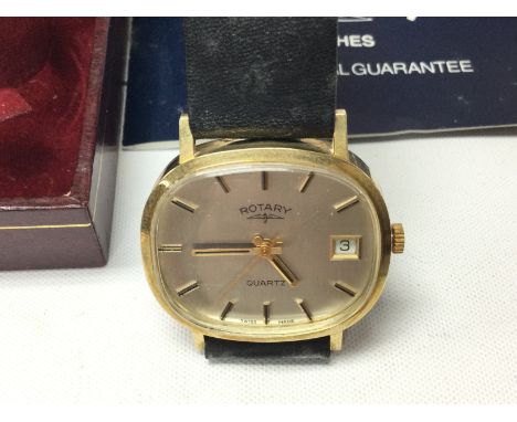 A 1980s 9ct gold gents Rotary wrist watch on black leather strap. Not seen working comes with box and papers. 27g total weigh