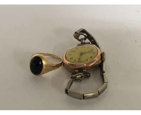 An unmarked gold ring and a Vintage cased 9carat gold ladies watch (2)