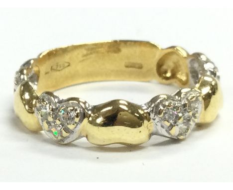 An 18ct gold diamond hearts band ring, total weight 3.1g . Size L Postage category A