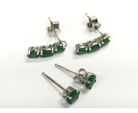 14ct white gold emerald and diamond studs , total weight 2.1g . Postage category A