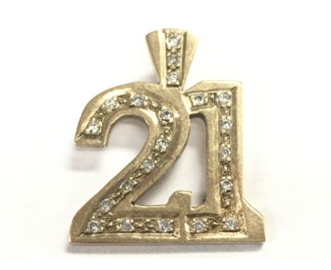 A 9ct gold diamond 21 pendant , total weight 5.3g. Postage category A