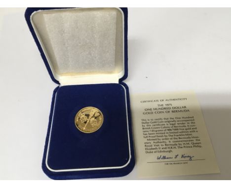 A 1975 gold coin of Bermuda one hundred dollars with certificate of Authenticity 7.03g of 900/1000 gold.