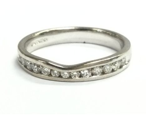 An 18ct white gold ring diamond 1/2 hoop ring. Size O. 3.7g Postage category A