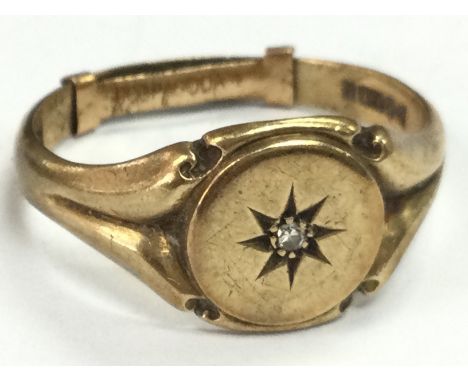 A Gents 9ct gold ring set with a small diamond , size 2. 6.2g Postage cat A