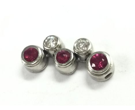 A Tiffany & Co platinum and ruby diamond drop pendant . Total weight 3.2g Postage category A