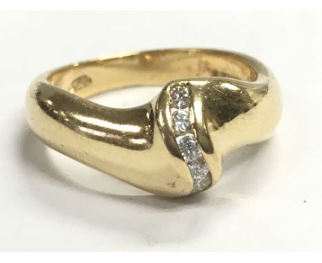 An 18ct gold diamond swirl ring, size N. Total weight 6.6g Postage category A