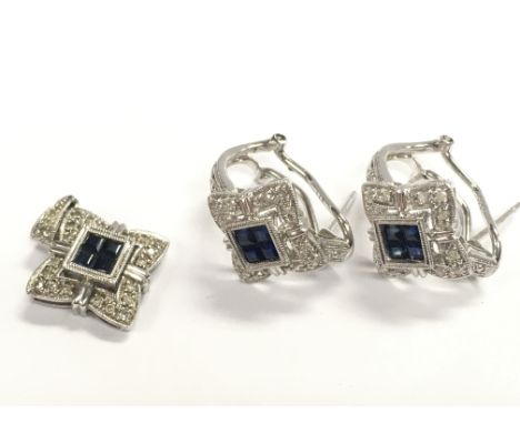 A 9ct white gold sapphire and diamond cluster stud pair of earrings and a pendant, total weight 6.4g. Postage category A