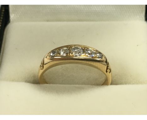 An 18ct gold diamond 5 stone ring , 3.17g total weight . Postage category A