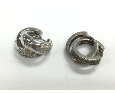 Two pairs of 9ct white gold hoop earrings ,total weight 6.7g . Postage category A