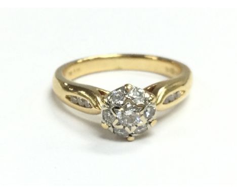 An 18ct gold diamond cluster ring , size I/J. Total weight 3.5g Postage category A