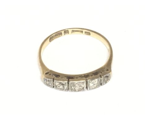 An 18carat gold ring set with a row of five small diamonds. Weight 2.3g