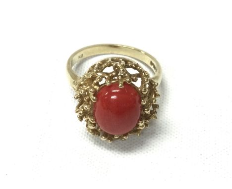 A 9ct gold ring set with coral. Size Q and 5.21g