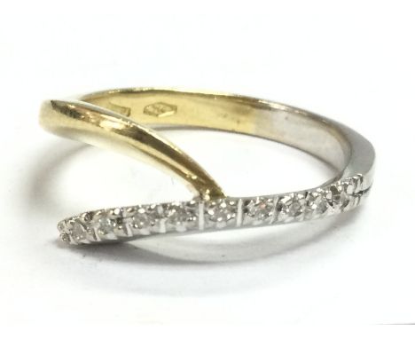 An 18ct diamond inset ring ,size P/Q. 5.3G total weight postage category A