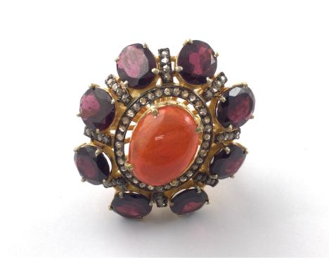 Large cocktail ring set with an orange oval cabochon opal oval cut garnet and rose cut diamonds in silver gilt. Opal 4ct appr