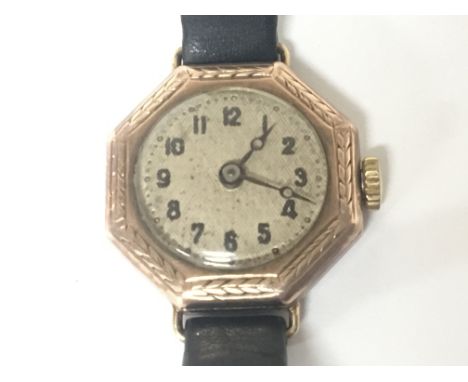 A Vintage 9carat gold ladies watch with a leather strap.