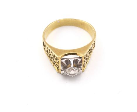 An unmarked high ct gold ring set with white sapphire. 5.53g and R 1/2