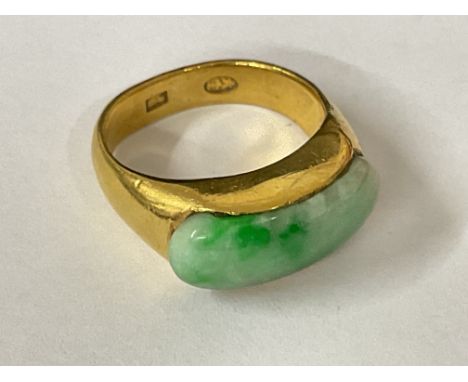 High ct gold ring inset with Jade and oriental hallmarks, approx 10.12g, ring size approx M, postage category A.