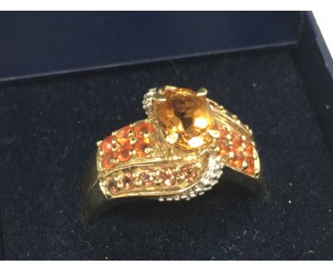 9 carat gold ring set with citrine stones , total weight 4.8g . Postage catA