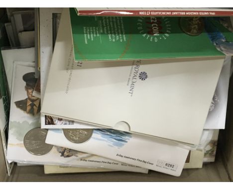 A box containing a quantity of Royal Mint coin sets coin first day covers and others and an album containing Republic of Phil