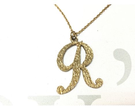 A 9ct gold R pendant 6g on a 15ct chain 4g