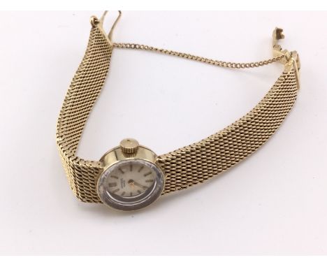 A 14ct gold ladies vintage watch. 22.14g Postage B