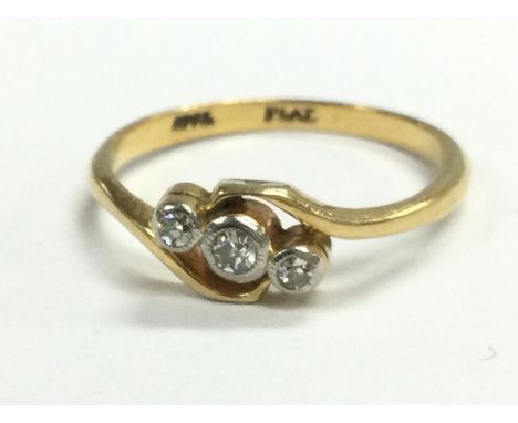 An 18ct gold and platinum three stone diamond ring , total weight 2.2g. Postage category A