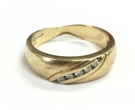 A 9ct gold ring set with a row of diamonds , size S. total weight 5.3g postage category A