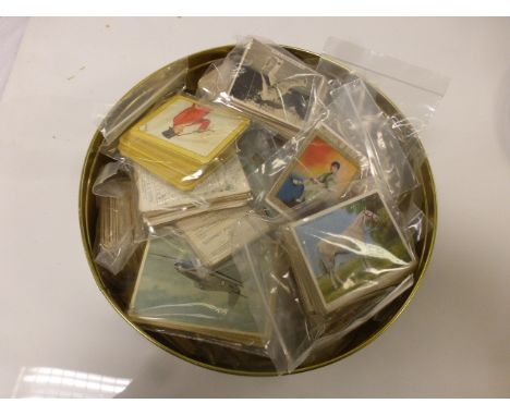 Tin of various cigarette cards to include Peeps into Many Lands, A Sporting Holiday in New Zealand, Celebrities and their Aut