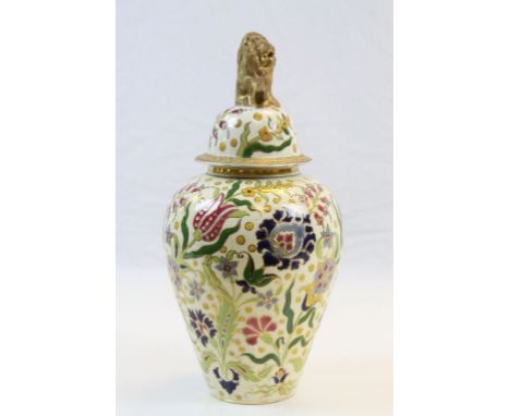 Ceramic Urn with Floral decoration &amp; gilt detailing and Lion finial to lid, base marked "Budapest", also has impressed ma