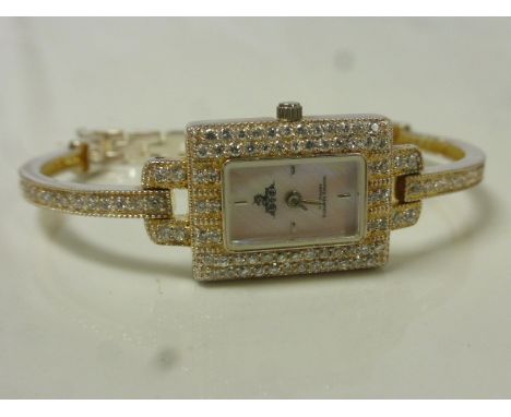 Ladies silver wristwatch with dyed mother-of-pearl dial, baton quarter markers, baton hands, diamante set surround and bracel