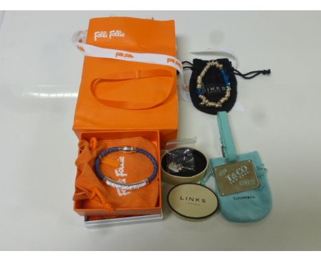 A Links of London charm in the form of a key, a Links of London bracelet, and boxed Folli Follie bracelet and a designer styl