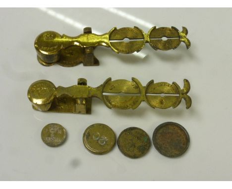 Two pairs of Victorian brass sovereign scales together with weights
